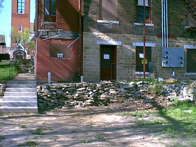 rear porch, 718, before new foundation facade
